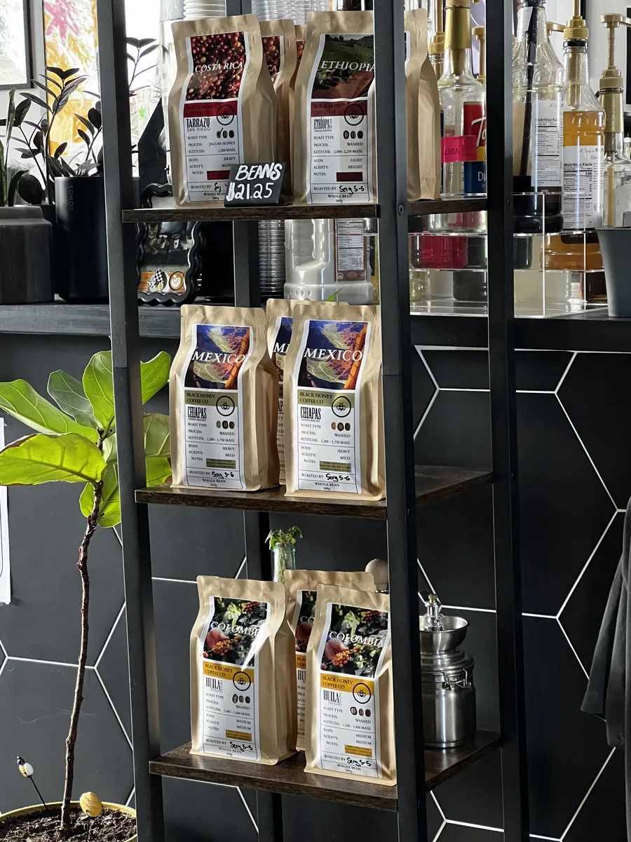 Bags of Black Honey single-origin coffee on the retail shelf
