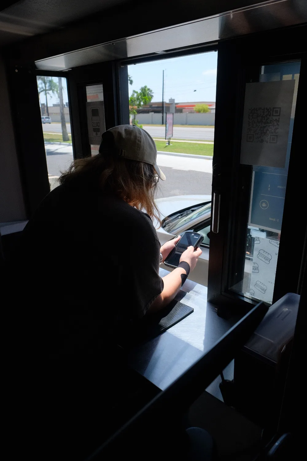 A Black Honey barista taking an order at the drive-thru window